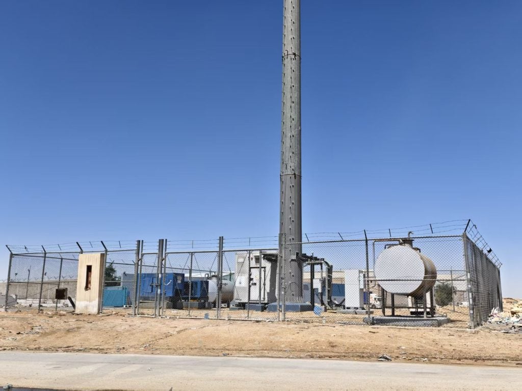 Telecom tower in Saudi Arabia powered by diesel generator and fuel tank, ready for solar-diesel microgrid upgrade
